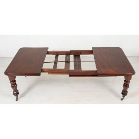 Antiker ausziehbarer Esstisch aus massivem Mahagoni