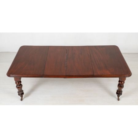 Antiker ausziehbarer Esstisch aus massivem Mahagoni