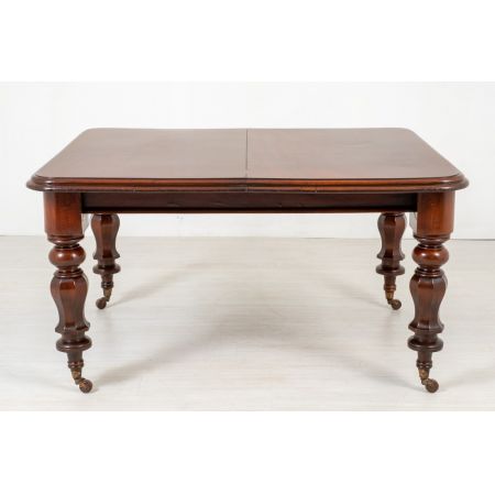 Antiker ausziehbarer Esstisch aus massivem Mahagoni