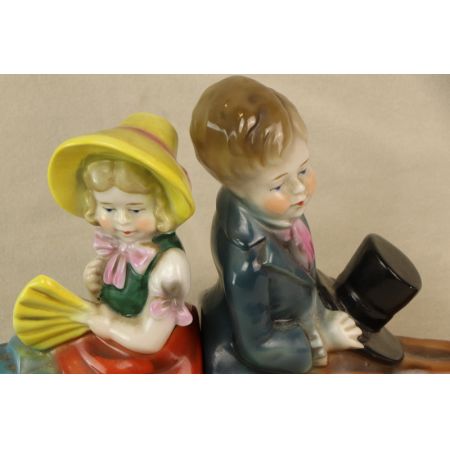 Set Junge und Mädchen Porzellan Figuren Buchstützen