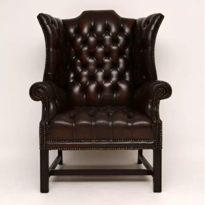 Antiker Deep Buttoned Leather Wing Back Armchair