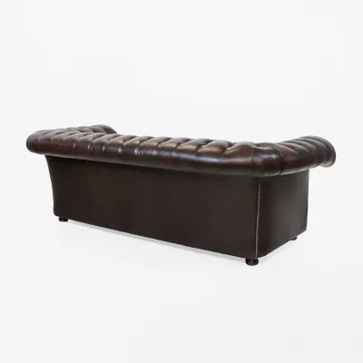 Ledersofa mit geschwungener Rückenlinie und Rollarmen