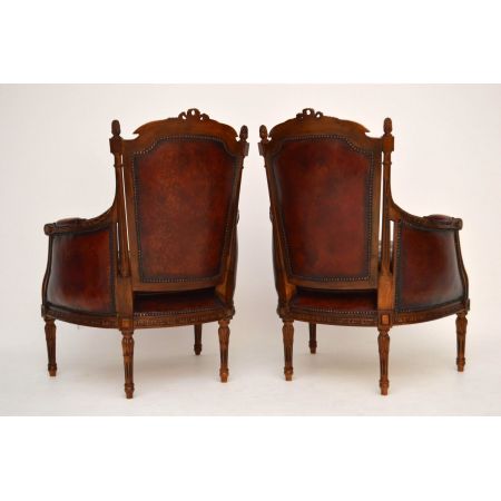 Ein Paar antike geschnitzte Nussbaum - Leder Sessel