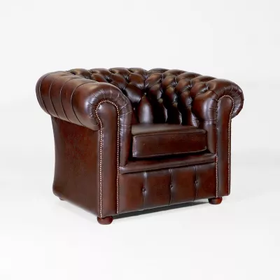 Luxuriöser brauner London-Classic Chesterfield Sessel aus hochwertigem Anilinleder – handgefertigt mit Massivholzrahmen und bequemer Polsterung.