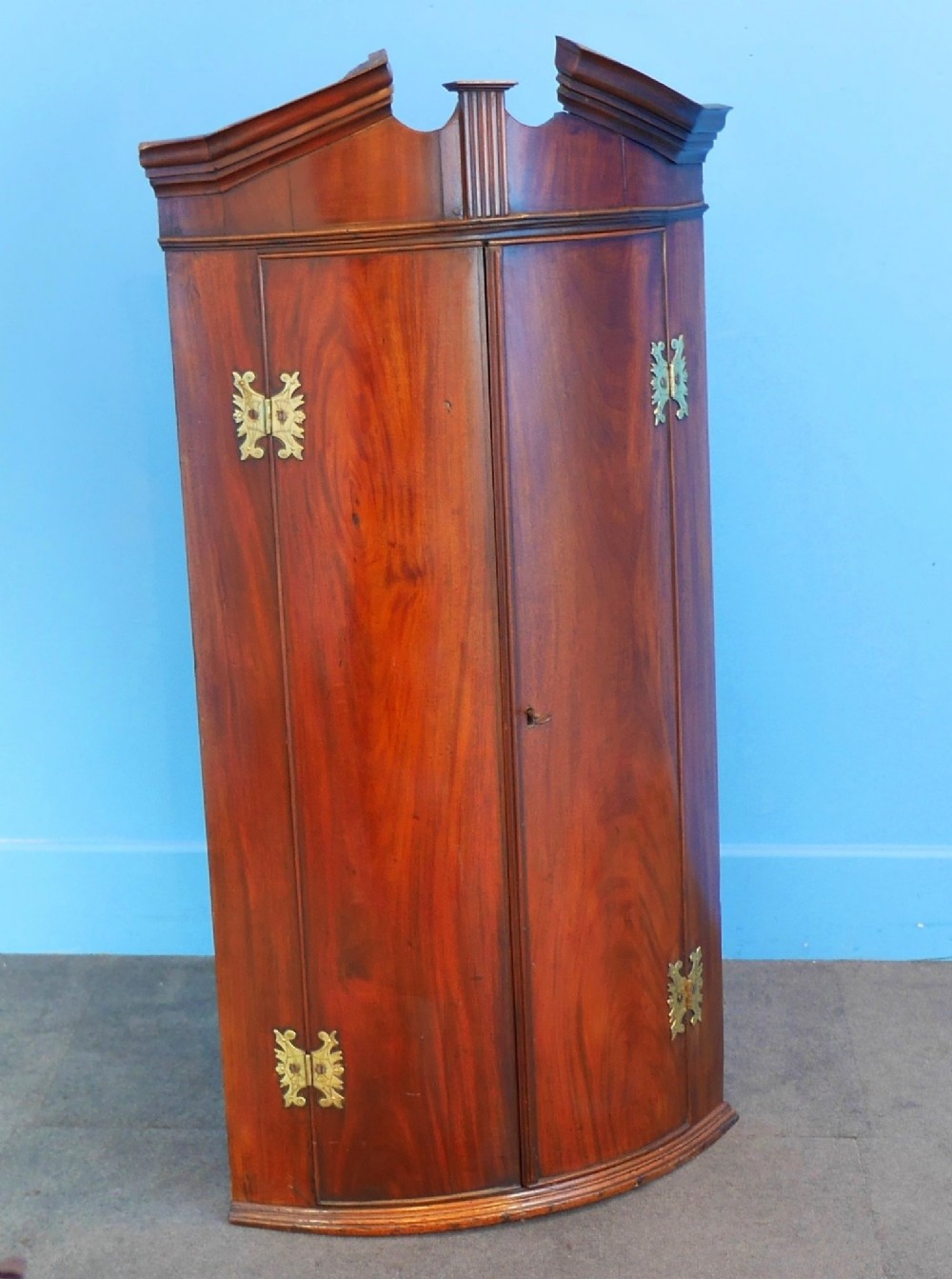 mahogany bow front corner cupboard ca. 1800